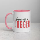 LOVE IS A DAGGER Mug with Color Inside