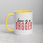 LOVE IS A DAGGER Mug with Color Inside