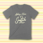 PREORDER -- ASHLEY KLEIN IS A SNITCH Unisex T-shirt