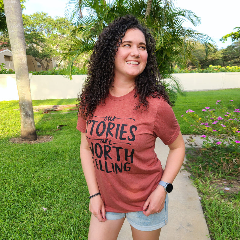 OUR STORIES ARE WORTH TELLING Unisex T-shirt